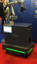 An image of a robotic stand with a robotic arm attached to it